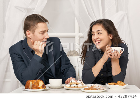 romantic couple drinking tea with cookies romantic couple drinking tea with cookies 45297414