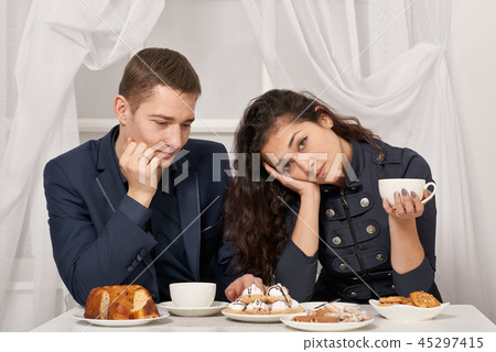 romantic couple drinking tea with cookies romantic couple drinking tea with cookies 45297415