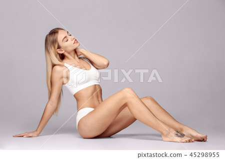 Perfect slim toned young body of the girl . 45298955