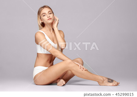 Perfect slim toned young body of the girl . Perfect slim toned young body of the girl . 45299015