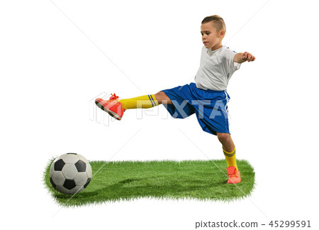 Young boy with soccer ball doing flying kick 45299591