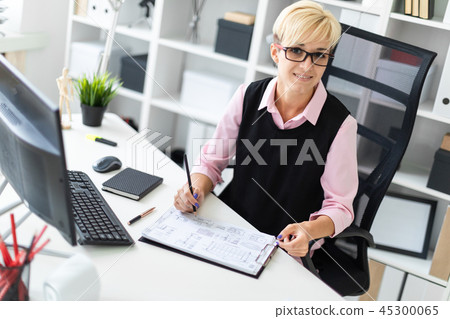 Young girl fills out documents Young girl fills out documents 45300065