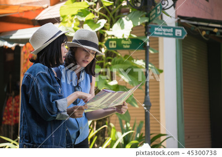 Travel Concept. Beautiful girls are happy to travel. Beautiful g 45300738