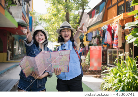 Travel Concept. Beautiful girls are happy to travel. Beautiful g 45300741
