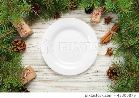 Empty plate on wooden christmas background 45300879