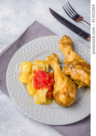Baked chicken leg Shin with vegetables tomato Baked chicken leg Shin with vegetables tomato 45302804