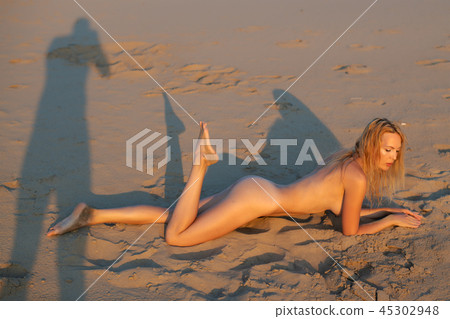 Beautiful girl model on sandy beach of the sea 45302948