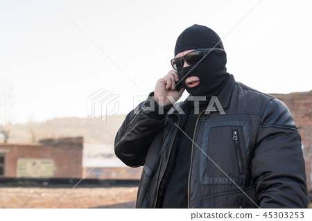 a bandit talking on the phone 45303253