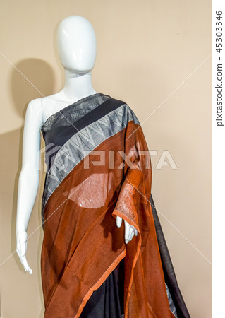 A traditional indian silk saree displayed for sale A traditional indian silk saree displayed for sale 45303346