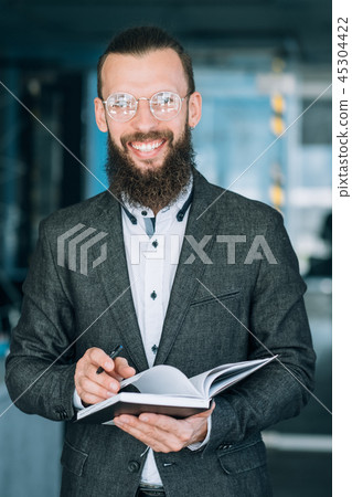 man writing info notebook records data analysis man writing info notebook records data analysis 45304422