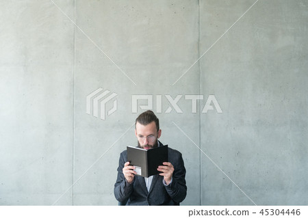 man focused reading bookworm knowledge learning 45304446