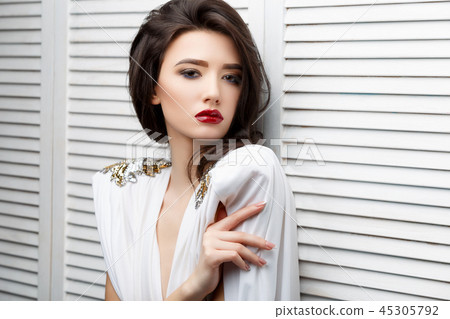 Brunette asian girl with long curly hair Brunette asian girl with long curly hair 45305792