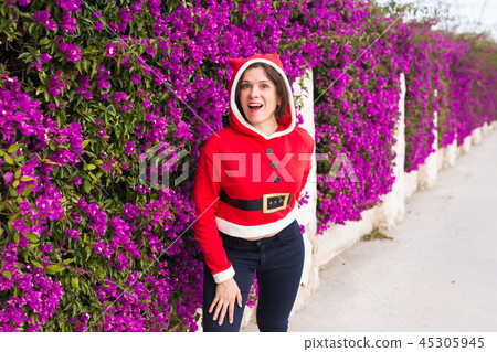 Holidays and people concept - smiling funny woman in christmas costume outdoors 45305945
