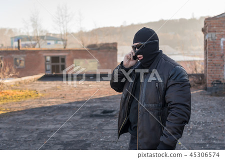 a bandit talking on the phone 45306574