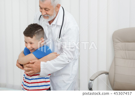 Boy on consultation with doctor in clinic. Boy on consultation with doctor in clinic. 45307457