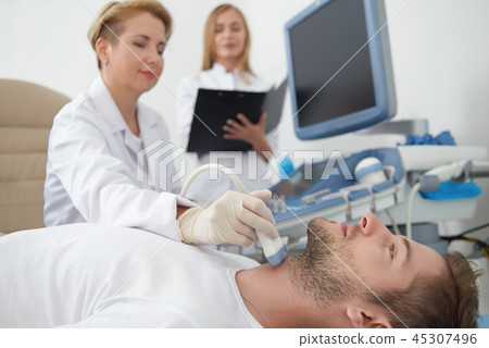 Doctor doing ultrasound diagnostics. 45307496