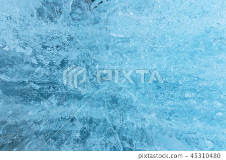 Blue ice texture, winter background, texture of ice surface. Blue ice texture, winter background, texture of ice surface. 45310480
