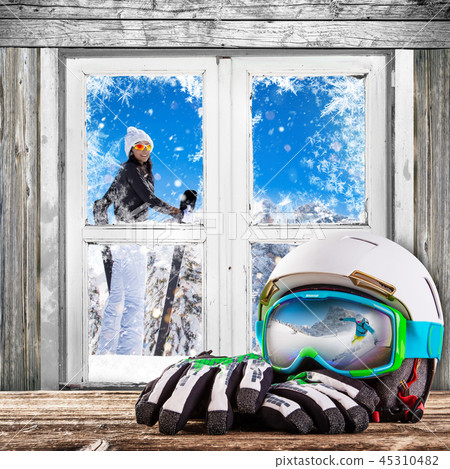 Winter old white window with ski helm and gloves. 45310482