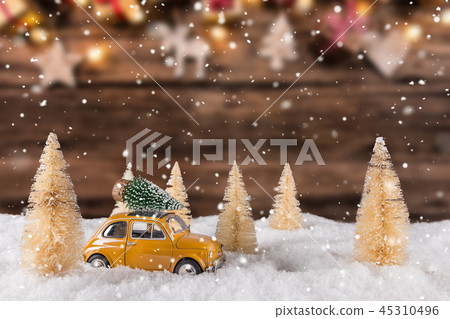 Christmas old car model with blurred background Christmas old car model with blurred background 45310496