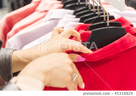 Woman choice a colorful jacket Woman choice a colorful jacket 45310829