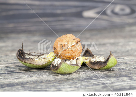 Walnuts on a wooden table Walnuts on a wooden table 45311944