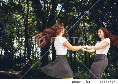 Cute sisters in a park 45314757