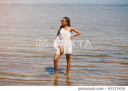 Black girl in a summer lake Black girl in a summer lake 45315439