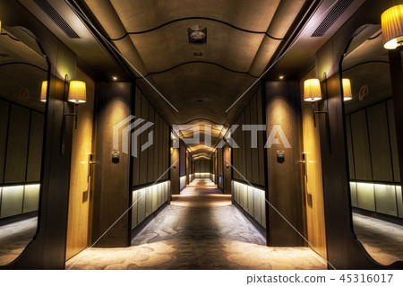 Long dark hotel corridor 45316017