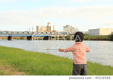 Children watching a train 45316508
