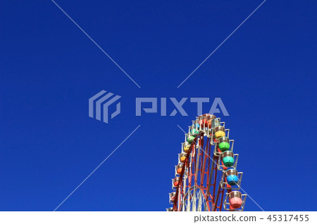 Big ferris wheel under blue sky Big ferris wheel under blue sky 45317455