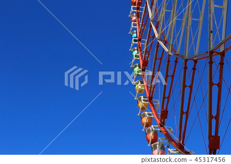 Big ferris wheel under blue sky Big ferris wheel under blue sky 45317456