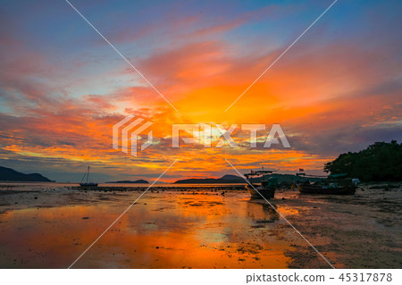 scenery reflection of sunrise on the beach 45317878