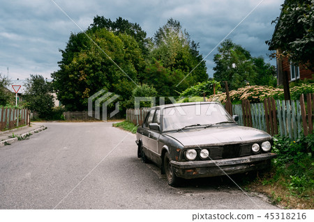 Luxury Sedan Car With Damages After Accident Abandoned In Villag 45318216