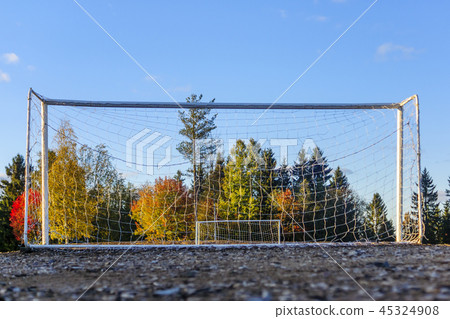 Poor empty football field with two football goals Poor empty football field with two football goals 45324908