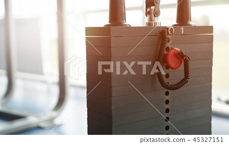 Blurred empty gym interior with equipment 45327151