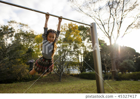 Girls playing with iron bars 45327417