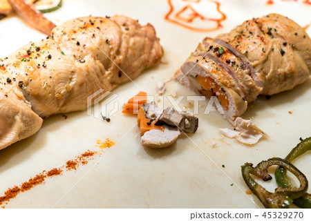 Carving of stuffed chicken breast Carving of stuffed chicken breast 45329270