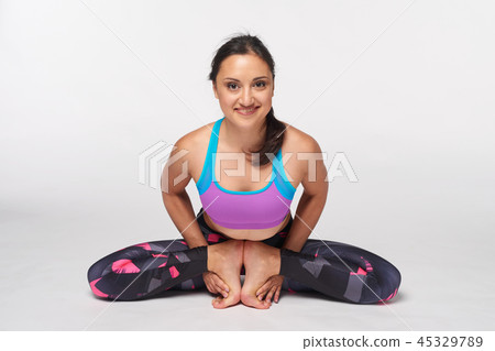 Woman practicing yoga Mulabandhasana, The Root Lock Pose 45329789