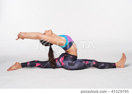Full length Woman practicing yoga Hanumanasana, Splits Pose Full length Woman practicing yoga Hanumanasana, Splits Pose 45329795