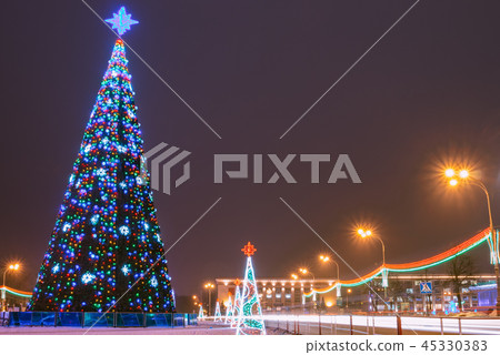 Cityscape with a Christmas fir-tree on the square Cityscape with a Christmas fir-tree on the square 45330383