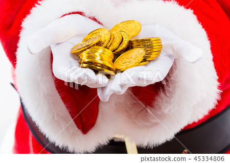 Santa holding pile of bitcoin 45334806