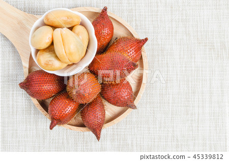 Salak Palm , waive or snake fruit in wooden dish. Salak Palm , waive or snake fruit in wooden dish. 45339812