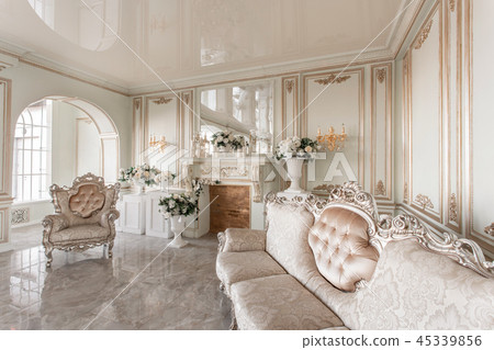 Morning in luxurious light interior in mansion . Bright and clean interior design of a luxury living Morning in luxurious light interior in mansion . Bright and clean interior design of a luxury living 45339856