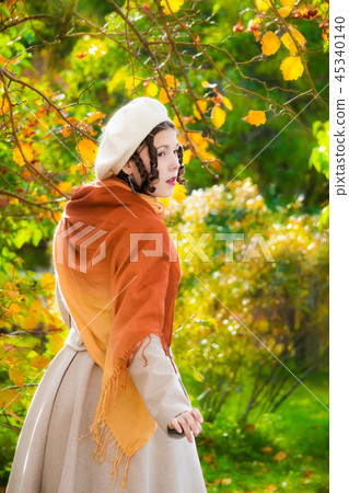 Girl with a in her coat and take on a walk Girl with a in her coat and take on a walk 45340140