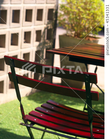 Wooden dining table and chair at green yard. Wooden dining table and chair at green yard. 45341331