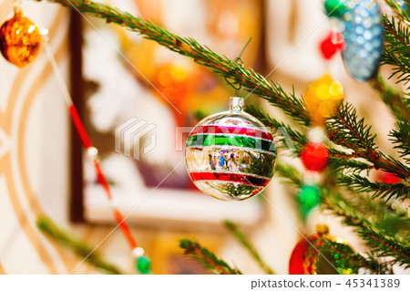 Fir tree decorated with old fashioned decorations Fir tree decorated with old fashioned decorations 45341389