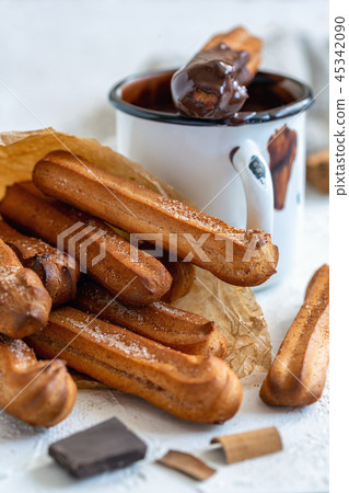 Spanish churros dessert with hot chocolate. Spanish churros dessert with hot chocolate. 45342090
