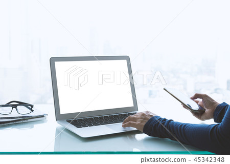 Women freelancer connecting to wireless via laptop Women freelancer connecting to wireless via laptop 45342348
