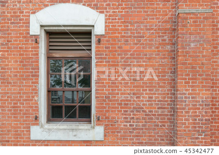 Brick wall with vintage window 45342477