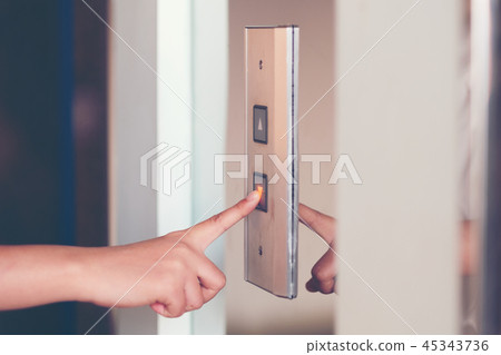 Close up waman hand press a up button of elevator Close up waman hand press a up button of elevator 45343736